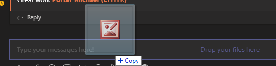 Dragging files into the message box on the Desktop version.