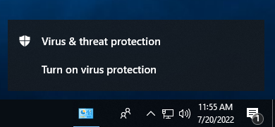 computer image showing lower task bar and virus and threat protection alert