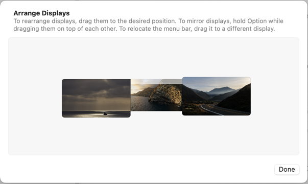 macOS 13.2's "arrange displays" system setting. Test in window reads, "to rearrange displays, drag them to the desired position. To mirror displays, hold option while dragging them on top of each other. To relocate the menu bar, drag it to a different display."